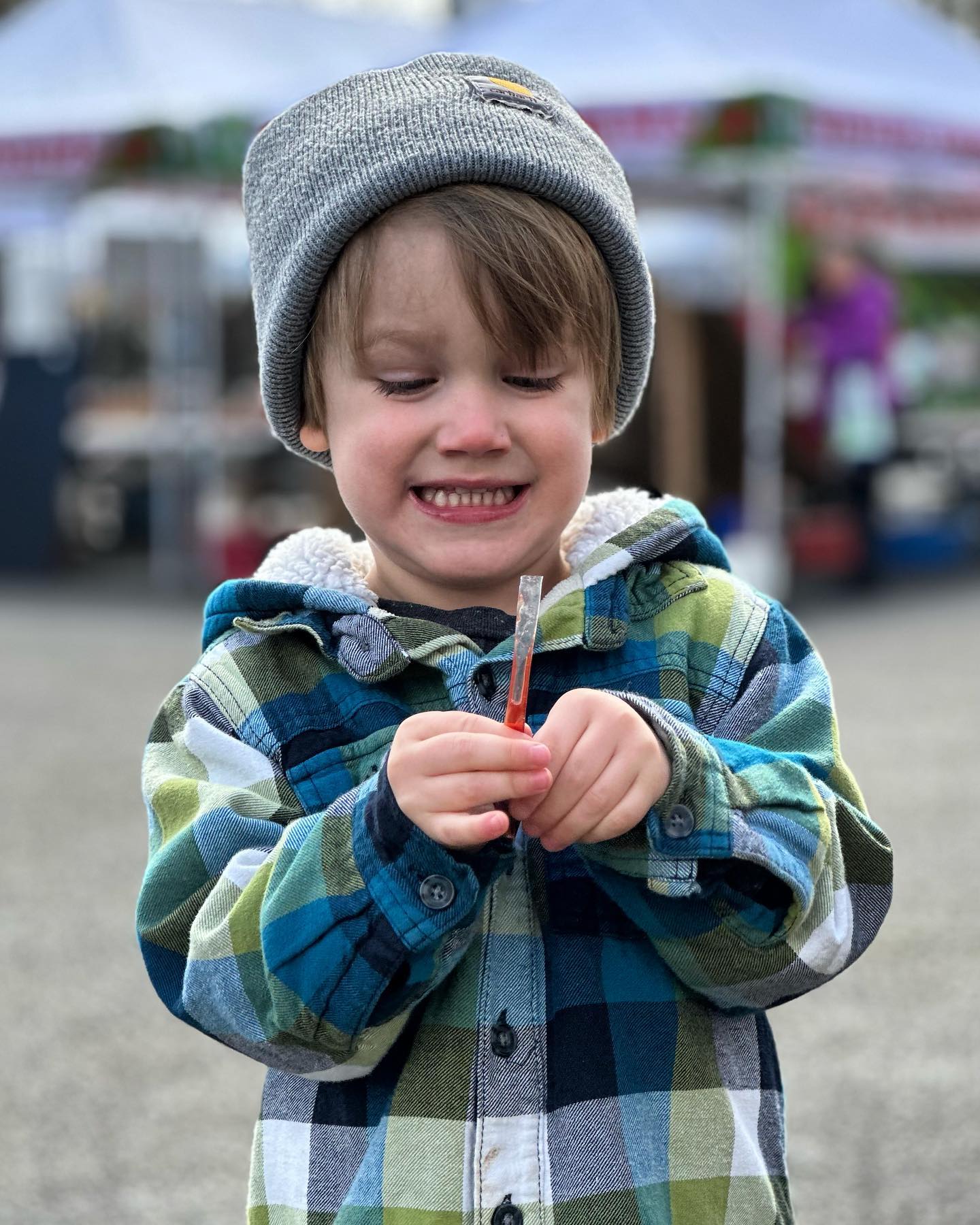 This kid was so excited all morning about getting a honey stick at the farmers market. Simple pleasures.